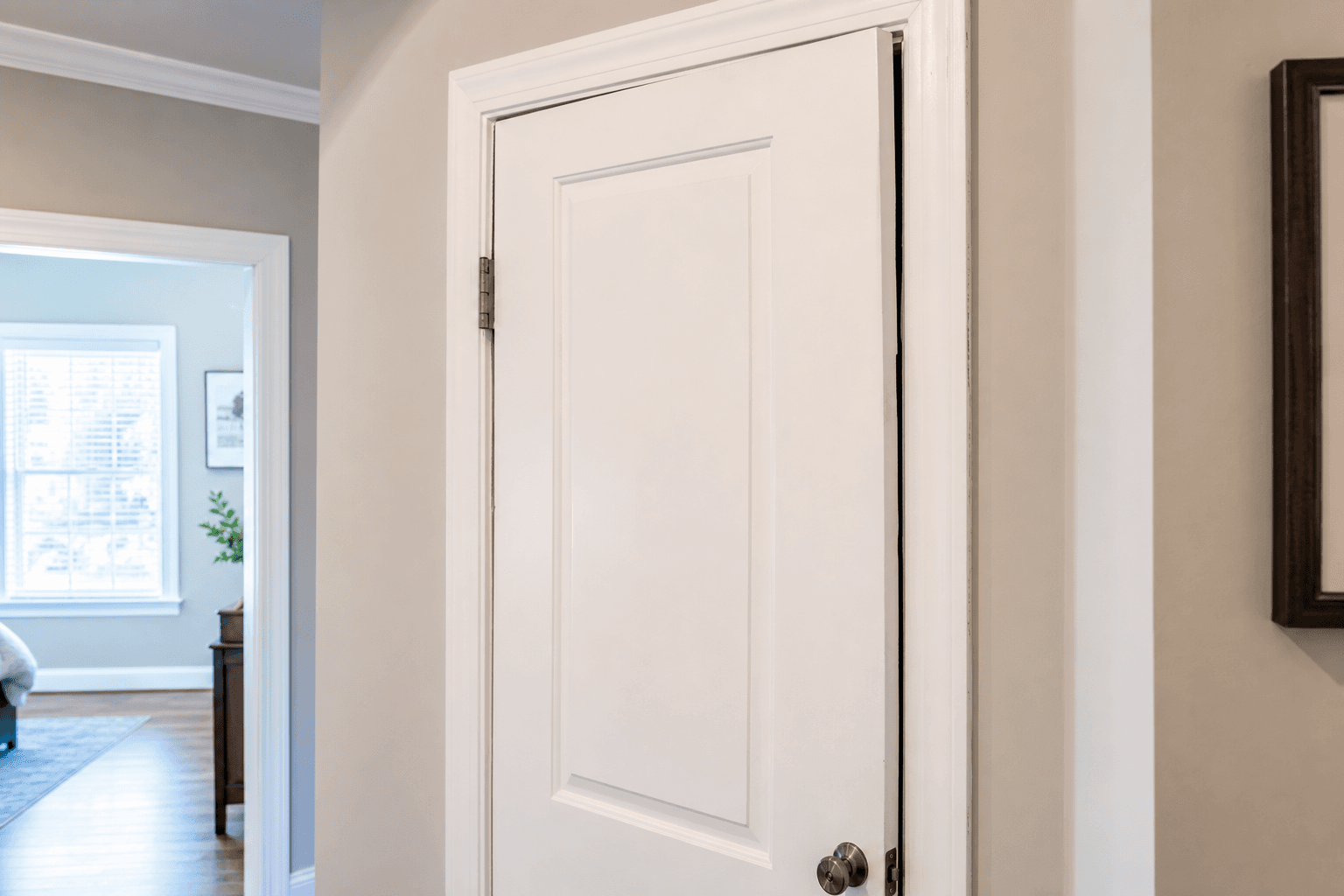 Interior door binding at the top corner of a slightly uneven frame
